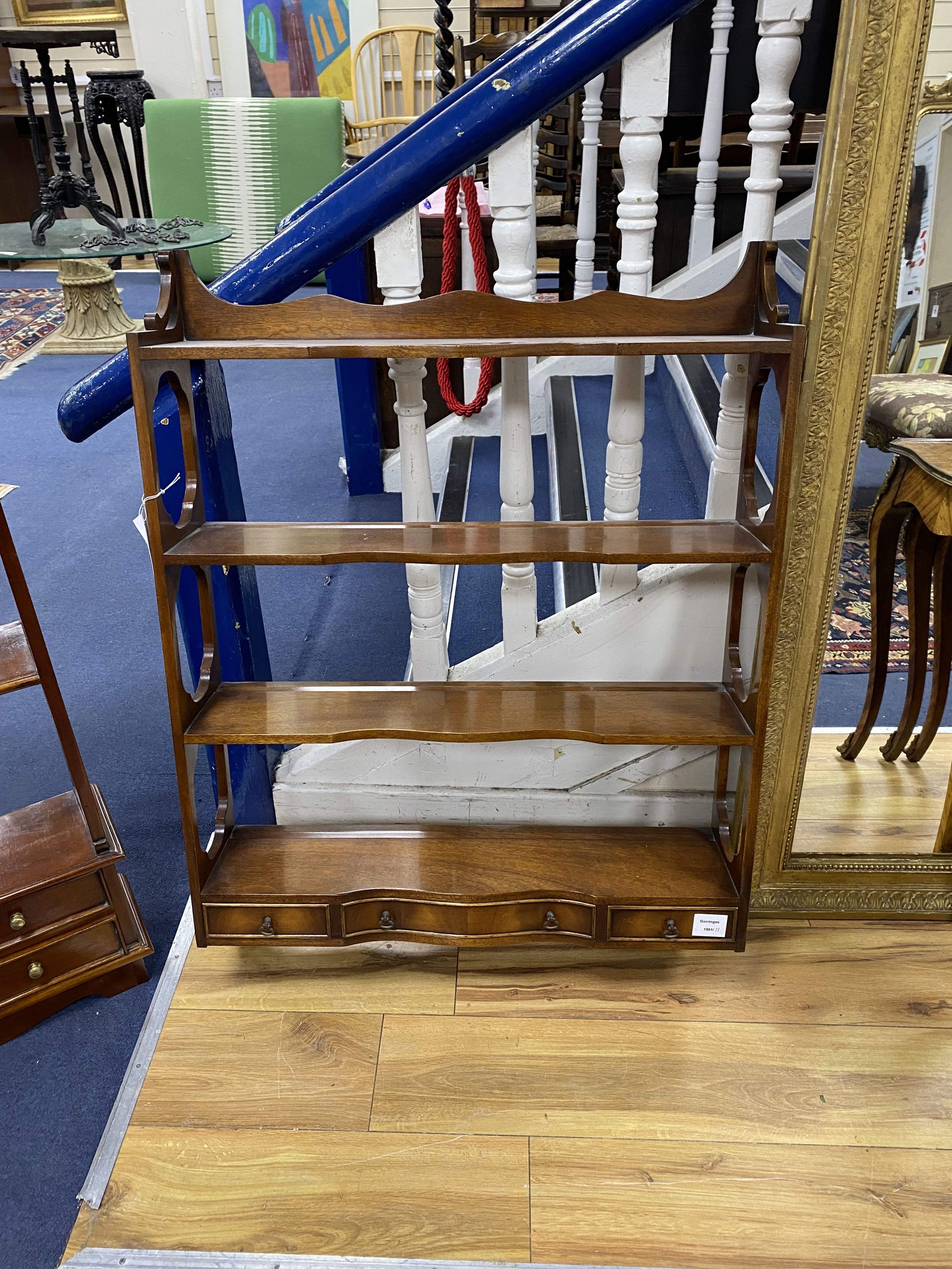 Two mahogany wall brackets, larger width 69cm, height 93cm